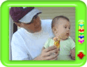 Baby eating orange ice-cream